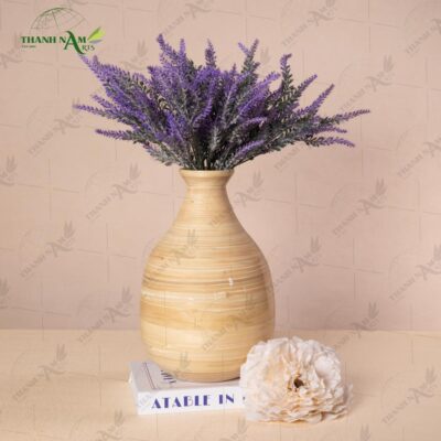 This bamboo vase design showcases handcrafted bamboo artistry with an eco-friendly aesthetic. Ideal for dried flowers and minimalist styling concepts.